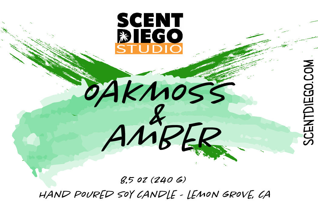 Scent Diego Studio candle packaging with 'Oakmoss & Amber' text and brand logo.