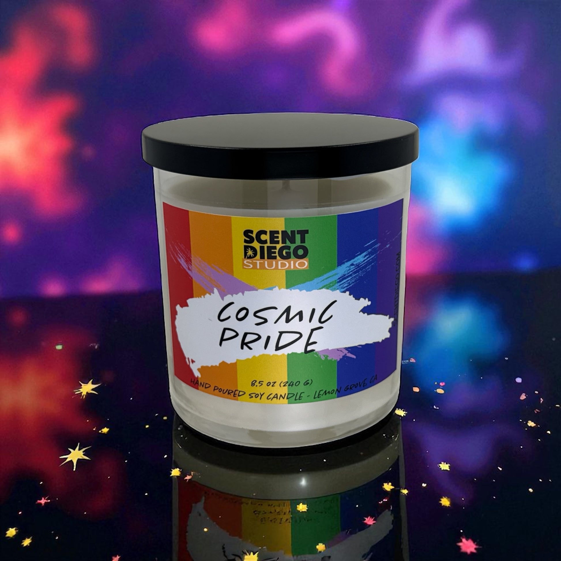 Candle with a 'Cosmic Pride' label against a colorful cosmic background