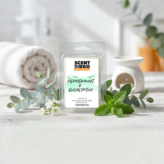 Scented wax melt package labeled 'Peppermint & Eucalyptus' by Scent Diego Studio on a white surface with greenery.